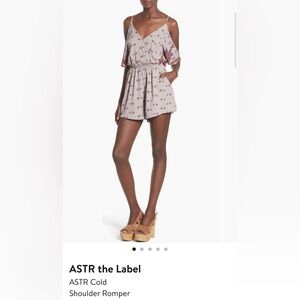 ASTR cold shoulder short romper. Purple paisley print. Size Medium.